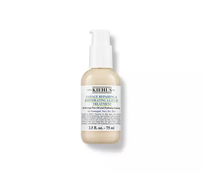 Kiehl's Damage Repairing & Rehydrating Leave-In Treatment in a beige bottle, designed for repairing damaged hair.