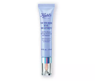 A tube of Kiehl's Youth Dose Eye Treatment featuring a lavender design, targeting dark circles and signs of aging.