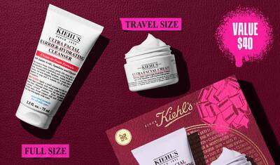 En grafikk som viser en hvit "KIEHL'S ULTRA FACIAL BARRIER-HYDRATING CLEANSER"-tube merket "FULL SIZE" og en mindre hvit "KIEHL'S ULTRA FACIAL CREAM"-krukke merket "TRAVEL SIZE". Øverst til høyre er det en rosa, sprutet tekstboks som sier "VALUE $40". En delvis Kiehl's gaveeske med en rosa grafisk sløyfe er synlig i nederste høyre hjørne.