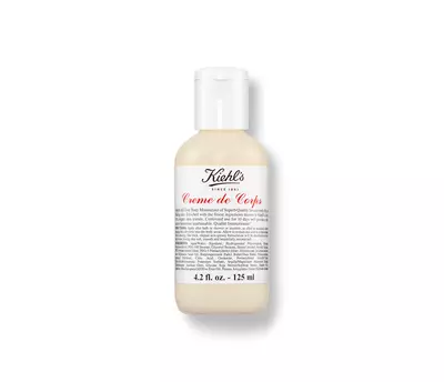 Kiehl's Creme de Corps moisturizer, 4.2 fl oz bottle, with a classic label, showcasing its creamy white texture.