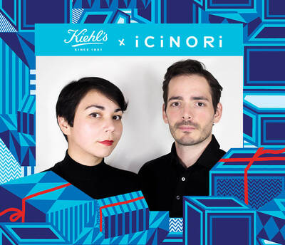 A promotional image featuring a woman with short dark hair and a man with short light brown hair, both wearing black clothing, set against a colorful graphic background with gift-like patterns. The image promotes a collaboration between Kiehl's and iCiNORI.