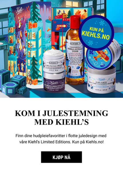 A festive display featuring Kiehl's limited edition holiday skincare products, including lotions and creams, set against a wintry backdrop with snowflakes and festive decorations.