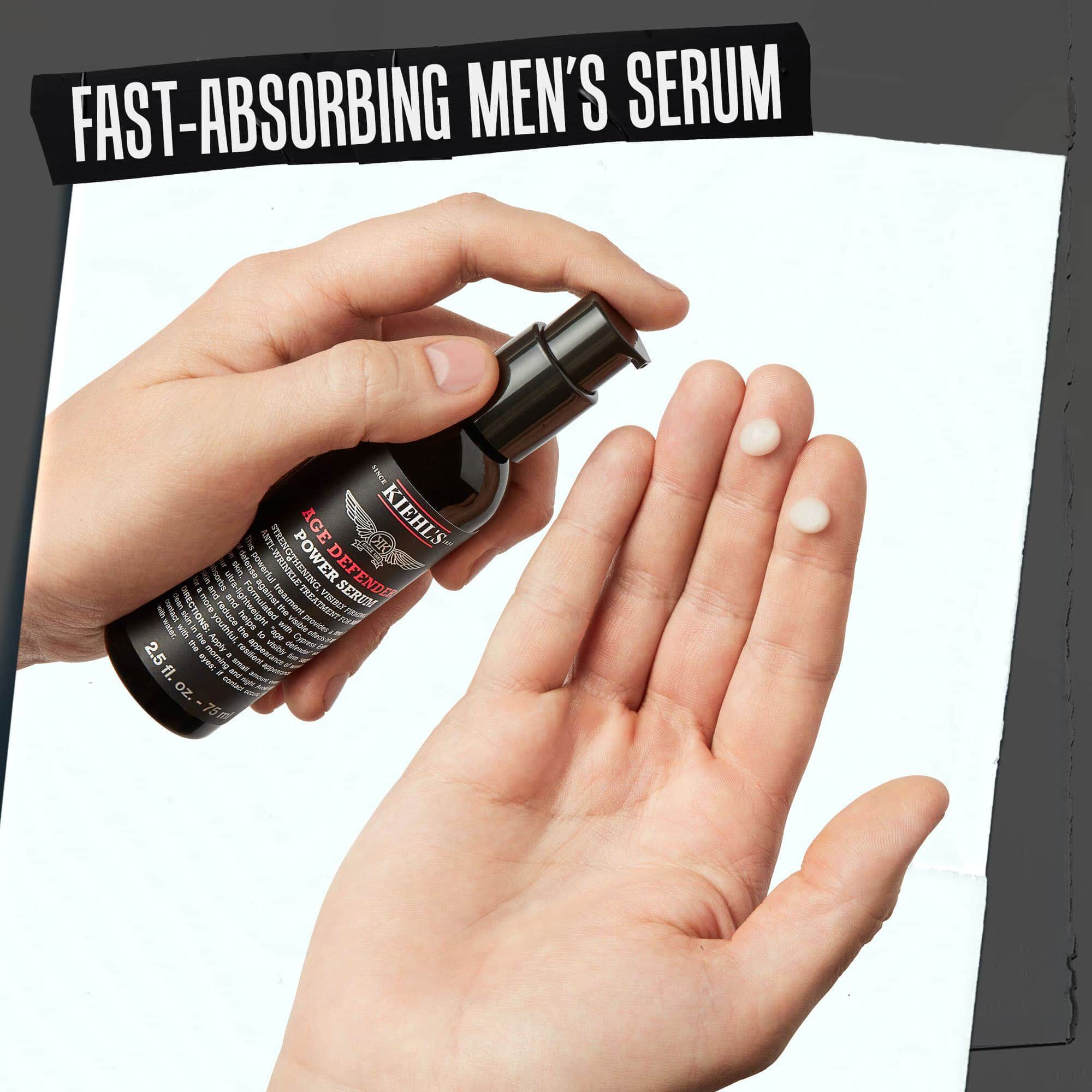 Hånd som doserer Age Defender Power Serum; hurtigabsorberende serum for menn.