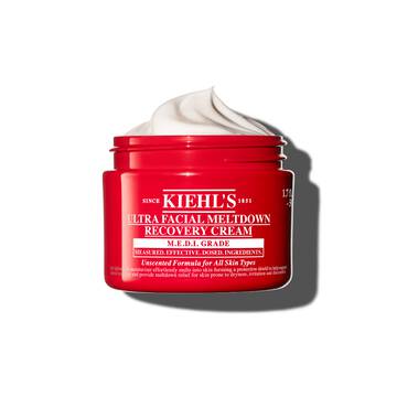 Rød krukke med Kiehl’s Ultra Facial Meltdown Recovery Cream Whip som viser en pisket kremtekstur.