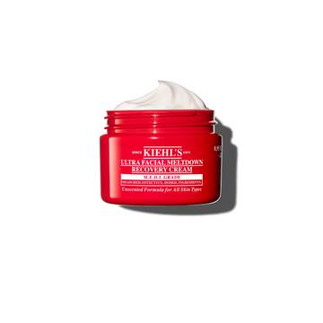 Rød krukke med Kiehl’s Ultra Facial Meltdown Recovery Cream Whip som viser en pisket kremtekstur.