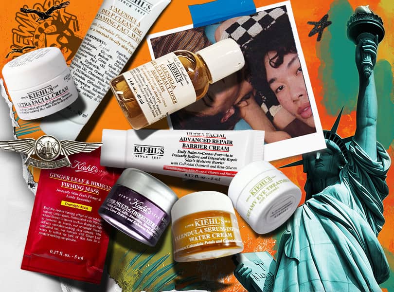 Et utvalg av Kiehl's hudpleieprodukter kunstferdig arrangert på en livlig oransje bakgrunn som forestiller Frihetsgudinnen.